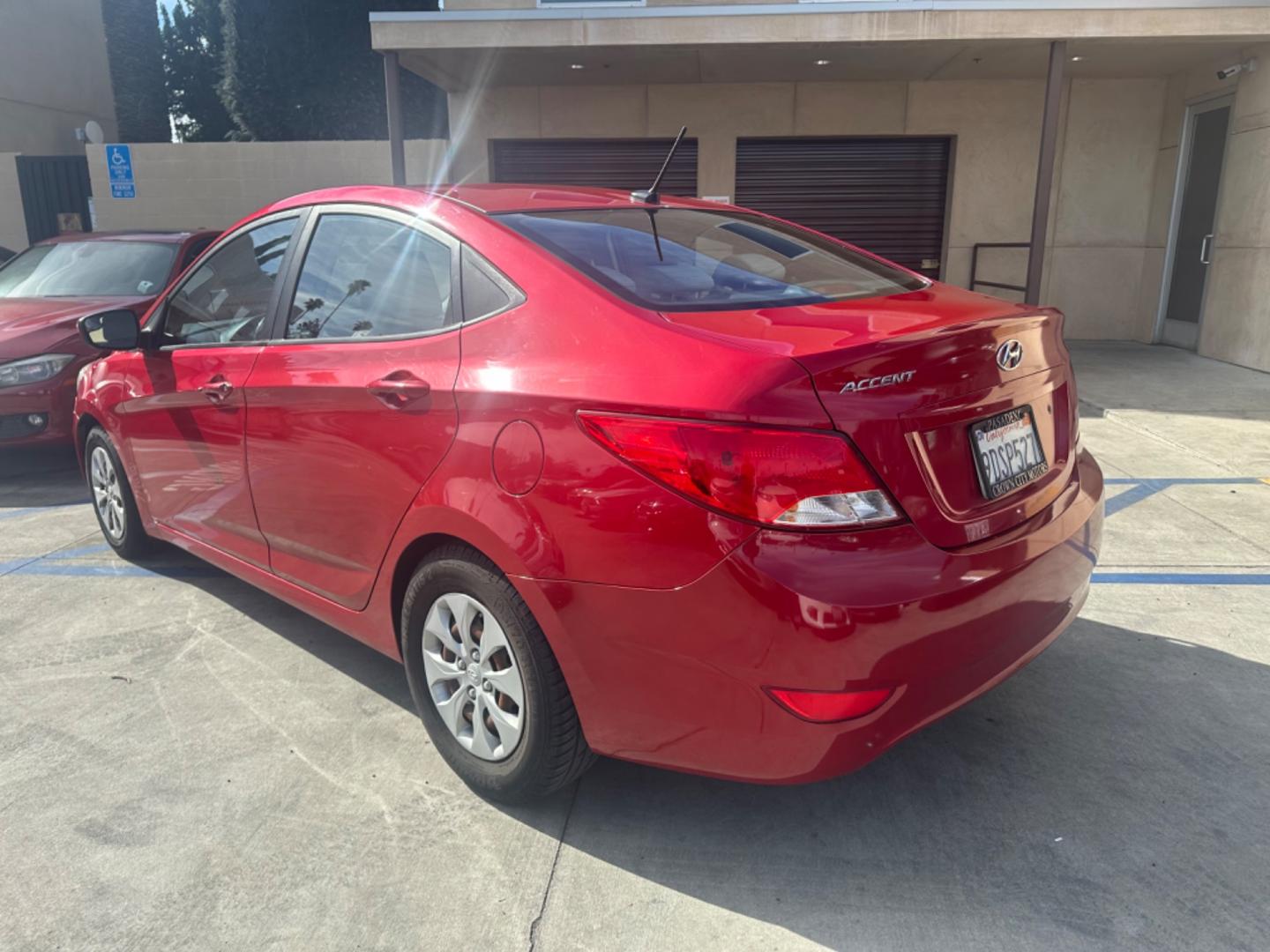 2015 Red /Gray Hyundai Accent GLS Sedan 4D (KMHCT4AE2FU) with an 4-Cyl, 1.6L engine, Auto, 6-Spd w/Overdrive transmission, located at 30 S. Berkeley Avenue, Pasadena, CA, 91107, (626) 248-7567, 34.145447, -118.109398 - The 2015 Hyundai Accent 4-Door Sedan stands as a testament to Hyundai's commitment to quality, efficiency, and value. Located in Pasadena, CA, our dealership specializes in providing a wide range of used BHPH (Buy Here Pay Here) cars, trucks, SUVs, and vans, including the remarkable Hyundai Accent. - Photo#3